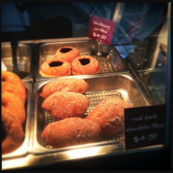 Homemade chocolate donuts and blackberry jam donuts